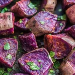 Roasted purple sweet potatoes on baking tray
